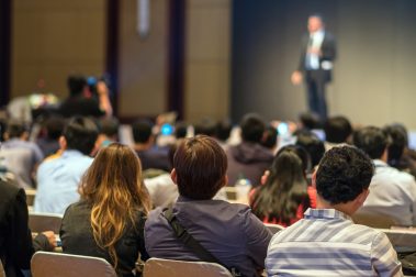 rear-side-of-audiences-sitting-and-listening-the-s-2022-12-16-03-32-47-utc