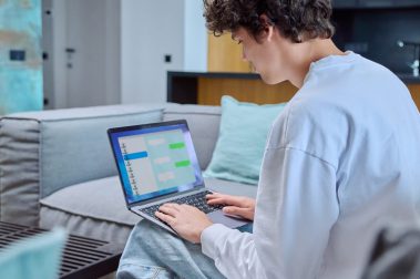 young-male-using-laptop-for-chat-sitting-resting-2023-07-01-00-44-06-utc